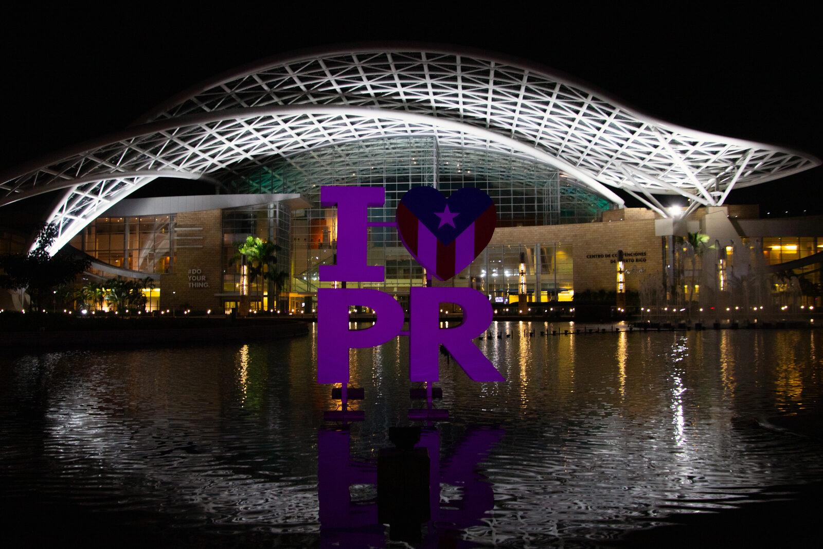 The Puerto Rico Convention Center at night — the district the event and its partner hotels sit in